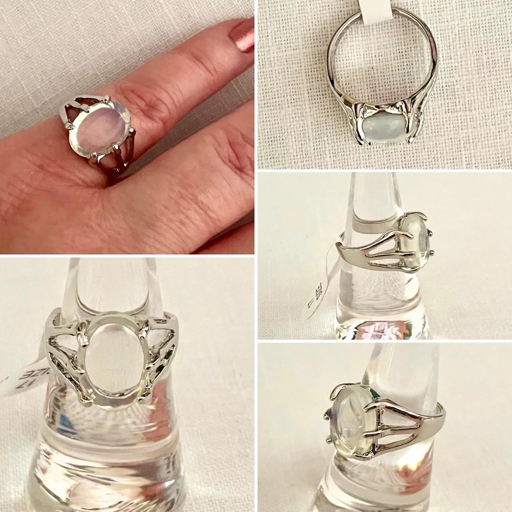 A clear white oval stone on a silvertone ring, US size  6 1/4-6 1/2, NEW